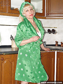 Mature Housewife Undressing In The Kitchen