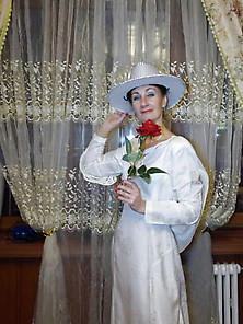 In Wedding Dress And White Hat
