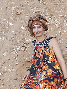 With Spear Wearing In Colorful Dress