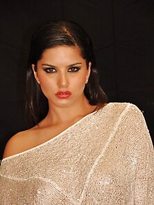 Sunny Leone Spreads Her Lips And Rubs Her Clit In A Silver Silk