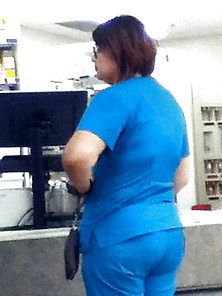 Girl In Scrubs At Store.