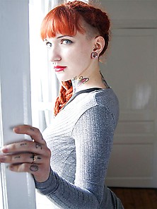 Red-Haired Mademoiselle In Black Harness