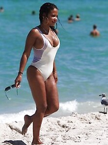 Christina Milian Pokies In White Swimsuit On The Beach