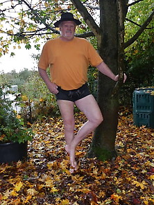 Barefoot In Shorts In Autumn Leaves