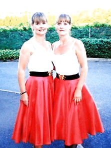Sexy Twins In Skirt And Dress.