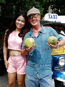 Man In Flat Cap And Sunglasses Asks Thai Lovely With Curly Hair