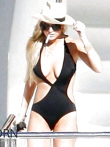 Lindsay Lohan...  In Taut Ebony Bathing Suit