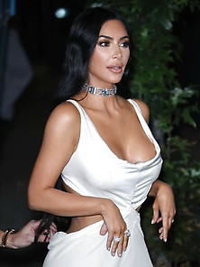 Kim Goes Braless In Sexy White Dress 2