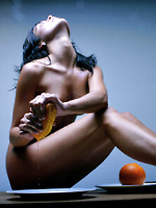 Brunette Beauty Posing Nude With Oranges
