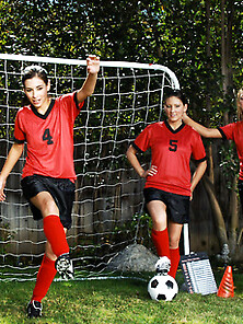Three Sexy Girls Warm Up On The Soccer Field Before Taking Advan