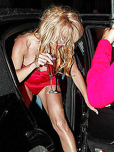 Pamela Anderson Grabs Her Big Fake Tits