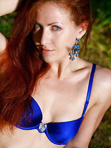 Blue-Eyed Redhead In Blue Lingerie Posing Naked With Her Ass On