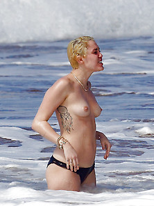 Miley Cyrus Swimming Topless In Hawaii