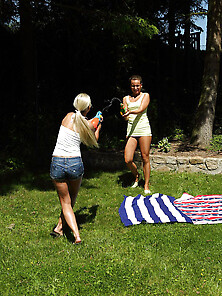 Friends Have Fun With Water Guns And Can't Resist Practicing Les
