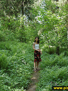 Teen Brunette Pissing Outdoor In The Forest