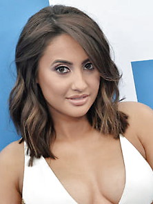Francia Raisa Stuns In Cleavage-Baring White And Gold Dress